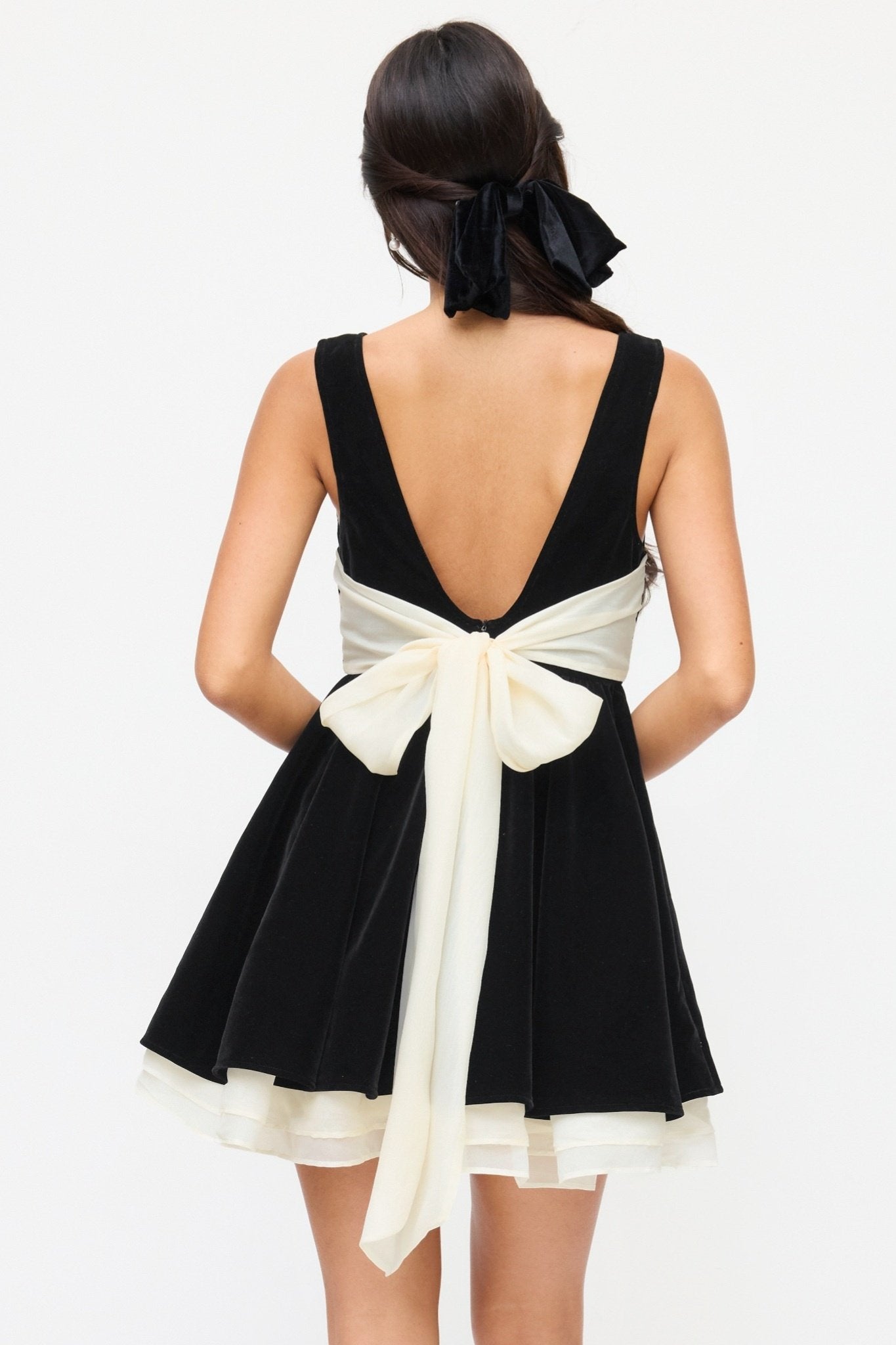 Ezabutus Black Velvet Boat Neck Mini Dress With Contrast Bow And Ruffle Hem