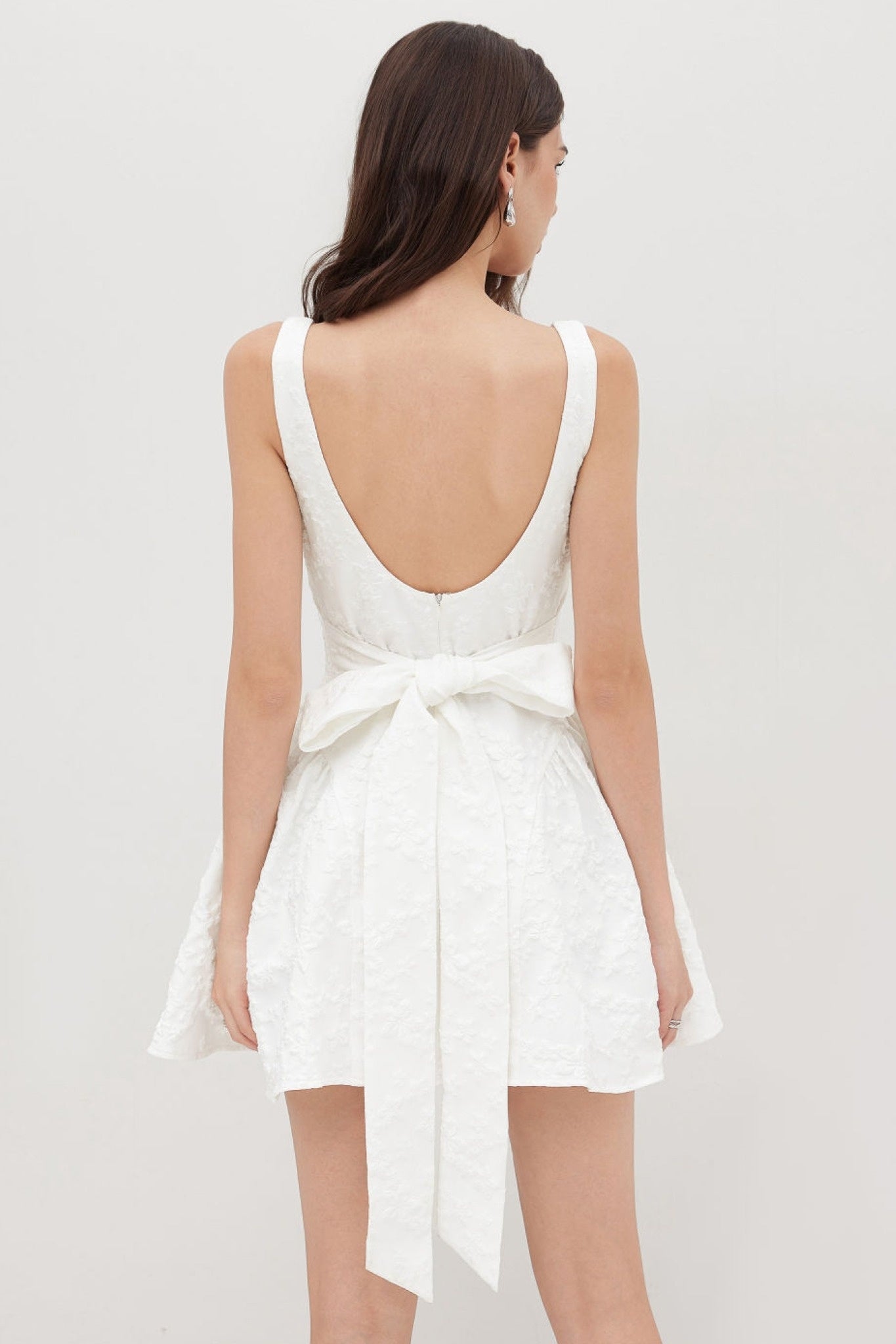 Ezabutus U Neckline White Floral Embossed Backless Bow Mini Dress