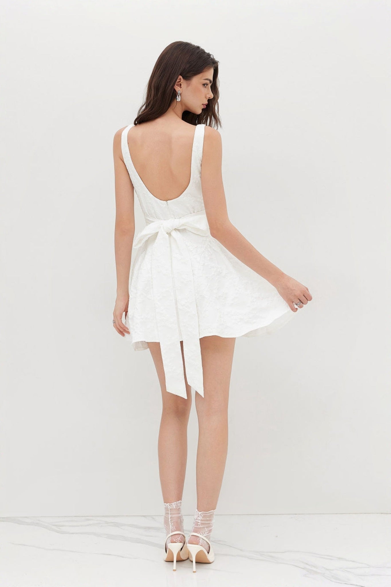 Ezabutus U Neckline White Floral Embossed Backless Bow Mini Dress