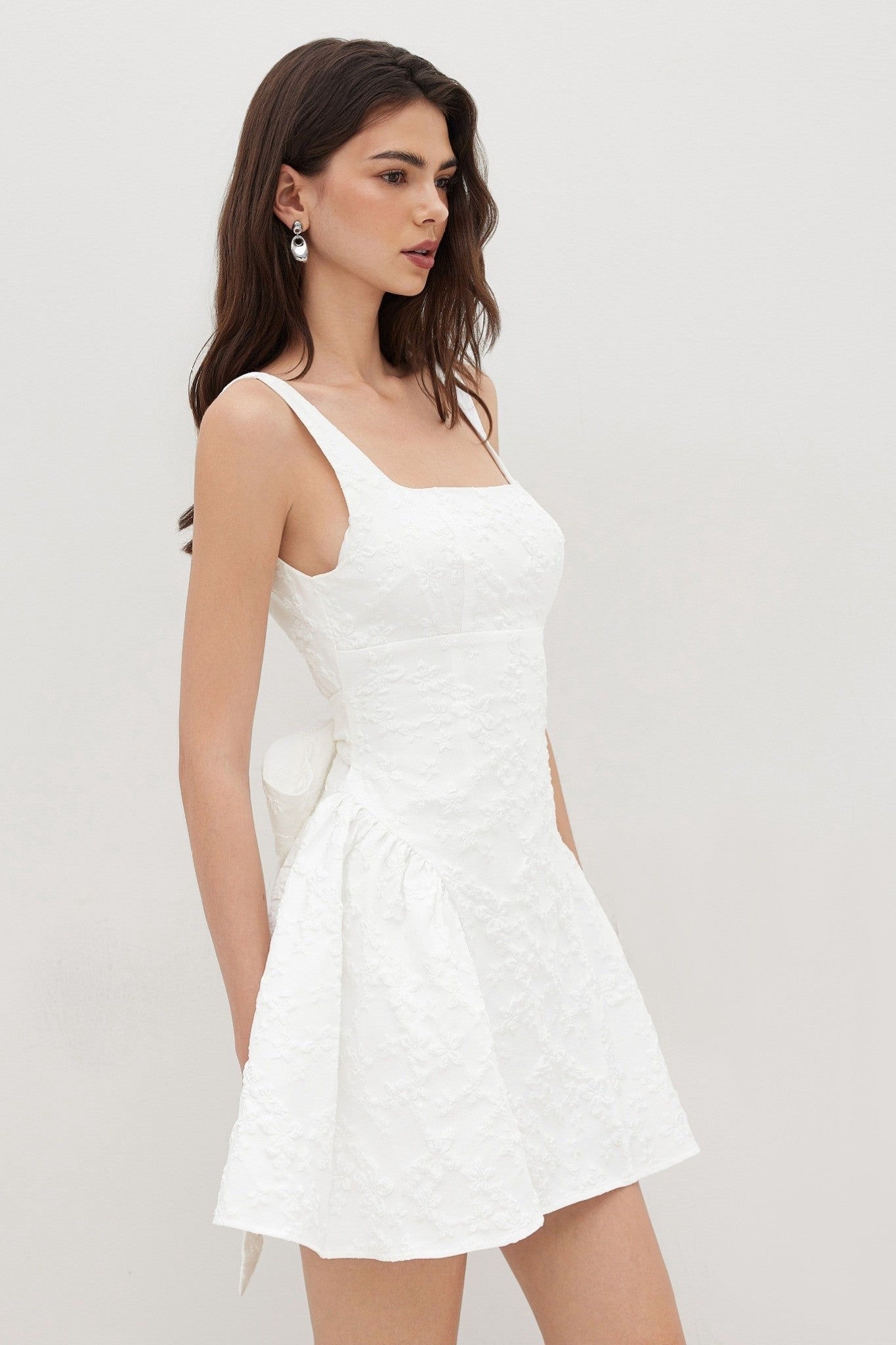 Ezabutus U Neckline White Floral Embossed Backless Bow Mini Dress