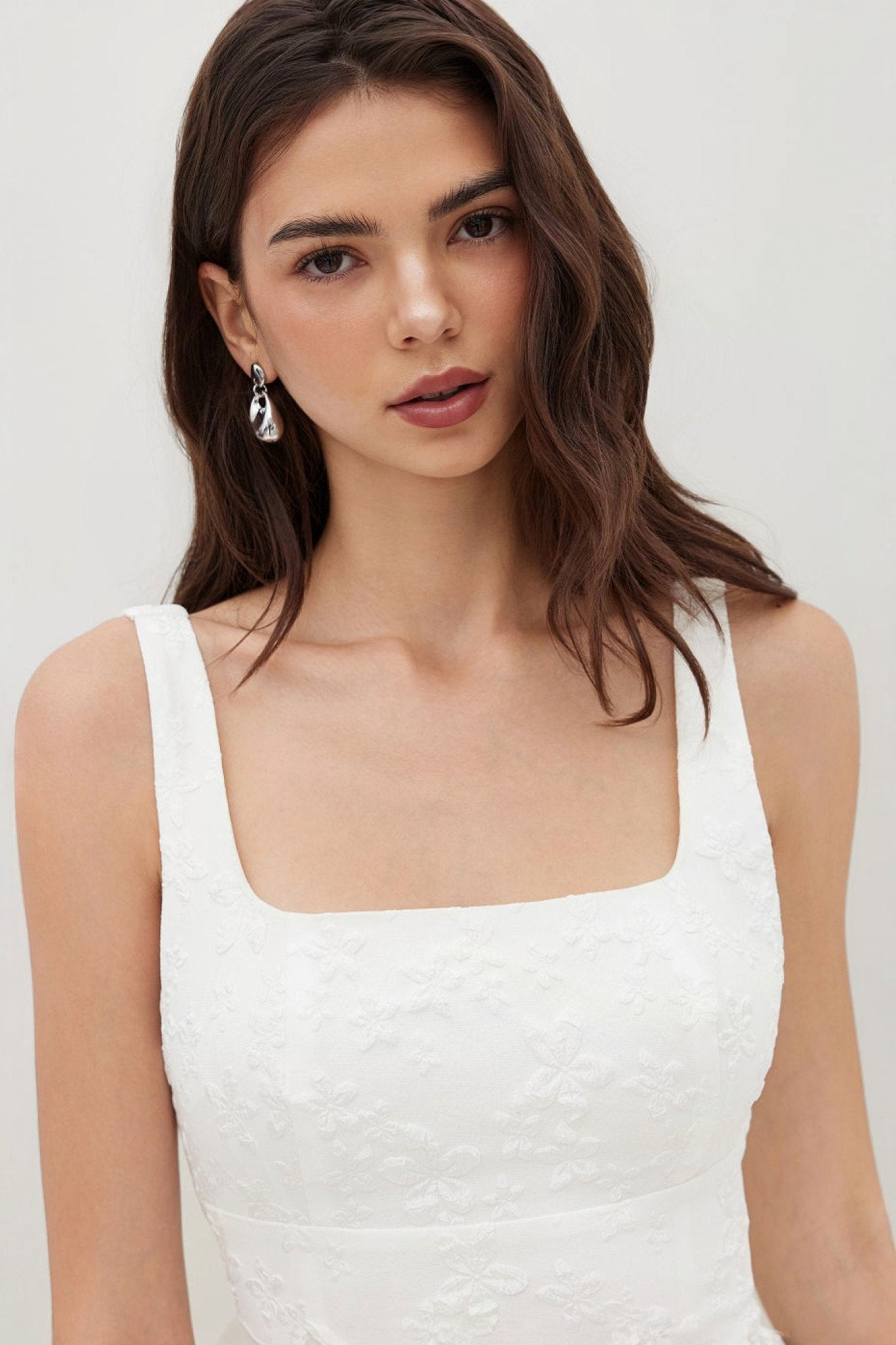 Ezabutus U Neckline White Floral Embossed Backless Bow Mini Dress