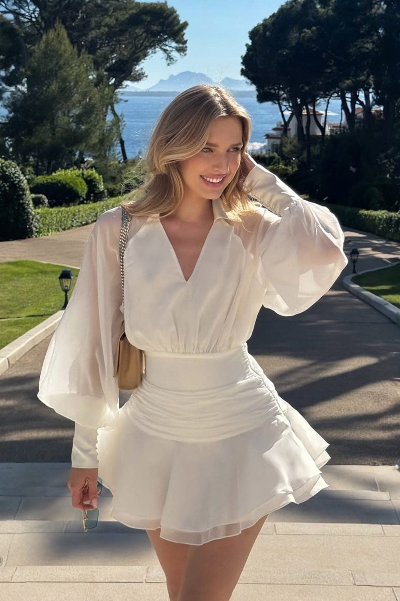 Ezabutus Elegant Sheer Sleeve Open Back Ruffled Hem Mini Dress